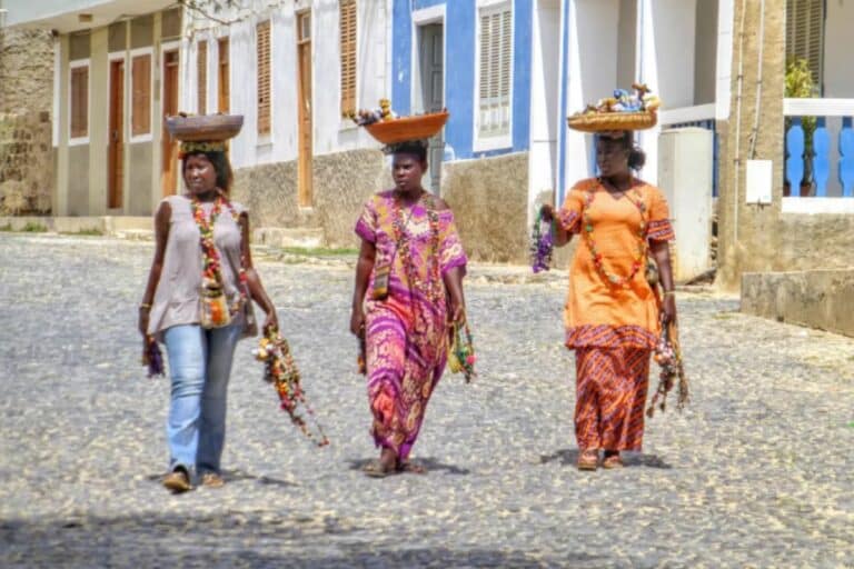 Three women walk the streets of Santa Maria