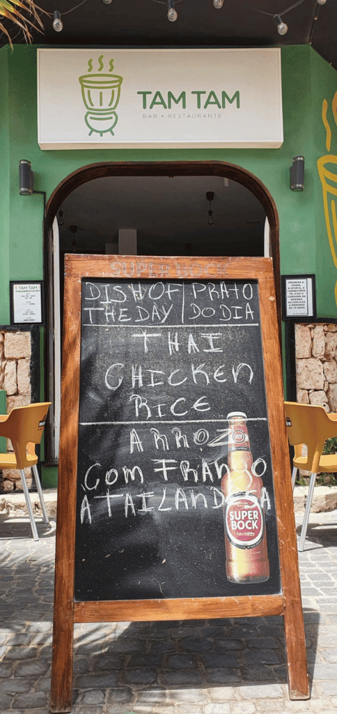 A blackboard shows the latest daily special (prato do dia) outside of Tam Tam.